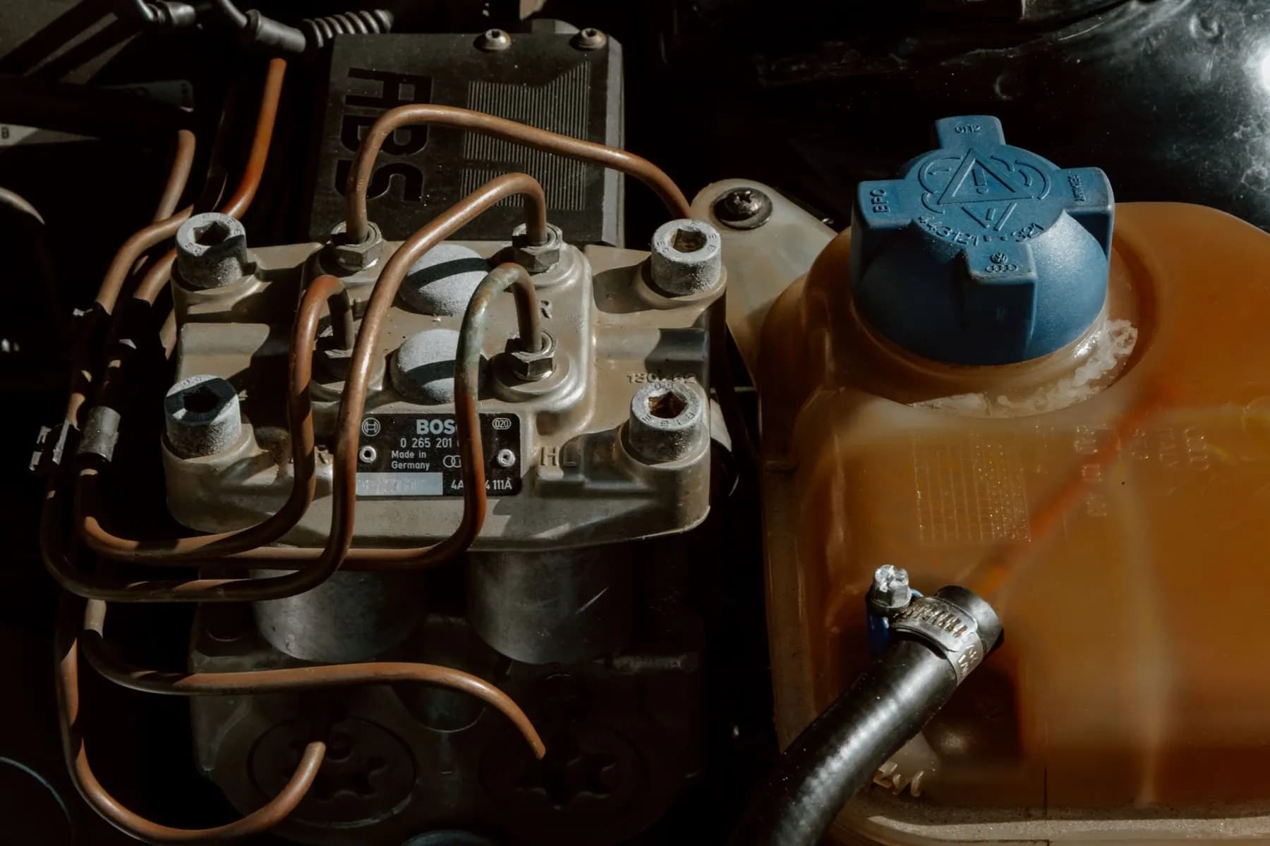 Automobile engine parts and mechanisms prepared for inspection.
