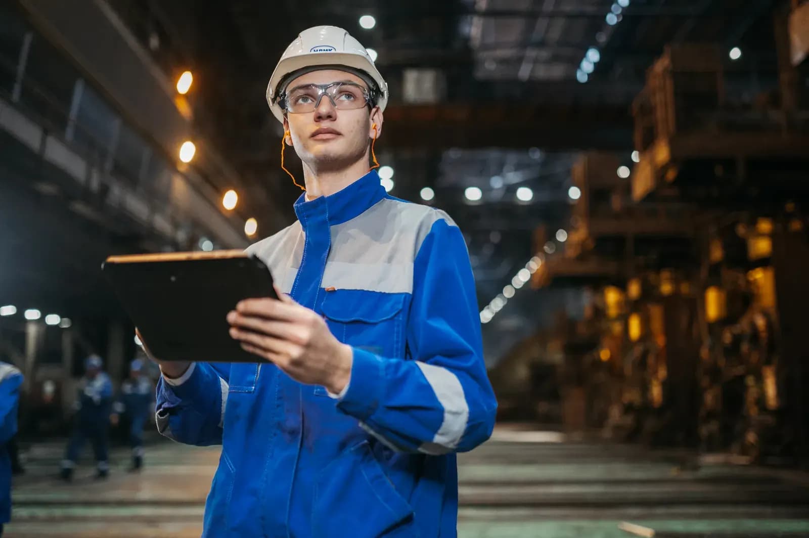 Engineer reviewing factory details during supplier selection.