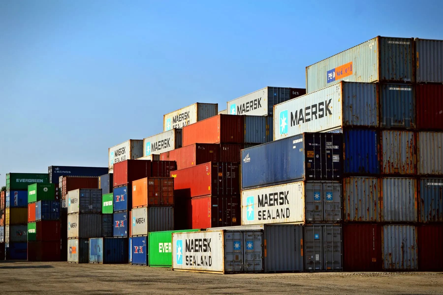 Cargo containers representing renewable energy freight and project delivery.